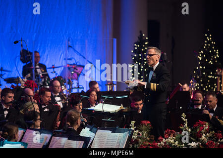 171217-N-DD694-1047 WASHINGTON (Dec. 17, 2017) Captain Ken Collins leads the United States Navy Band during the band's annual Holiday Concert. The Holiday Concert is one of the Navy Band's largest productions of the year. (U.S. Navy photo by Musician 1st Class Jonathan Barnes/Released) Stock Photo