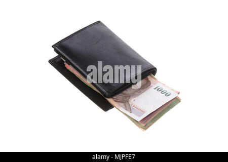 Thai baht banknotes inside a black wallet isolated on black. Stock Photo