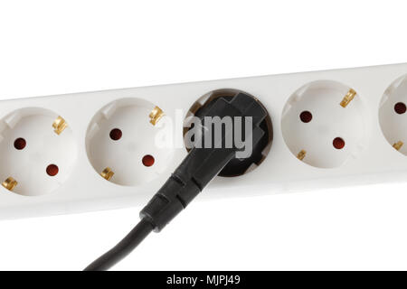 White power strip with attached black power plug. Stock Photo