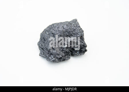 extreme close up with a lot of details of graphite mineral isolated over white background Stock Photo