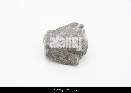 extreme close up with a lot of details of andesite volcanic rock isolated over white background Stock Photo