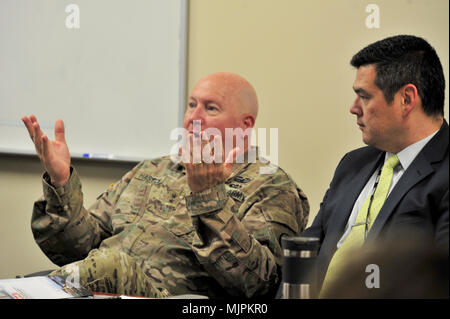 Maj. Gen. Terry “Max” Haston, Tennessee adjutant general, speaks during a partnering meeting at the Tennessee Emergency Management Agency in Nashville, Tenn., Dec. 19, 2017.  Patrick Sheehan, TEMA director, listens to the general during the meeting with the U.S. Army Corps of Engineers Nashville District and Memphis District. (Photo by Matthew Starling) Stock Photo