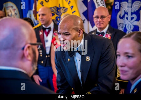 FORT BELVOIR, VA.-- (December 2, 2017)--  U.S. Surgeon General Vice Adm. Jerome M. Adams serves as the guest speaker for the National Capital Region's Holiday Ball hosted by the Belvoir Hospital December 2, 2017.  Held at the Fort Belvoir Officer's Club, the event drew attendees from throughout the region as a show of teamwork, camaraderie  and partnership.    The Defense Health Agency's National Capital Region (NCR) Medical Directorate was established to exercise authority, direction, and control over the Walter Reed National Military Medical Center, Fort Belvoir Community Hospital, and their Stock Photo