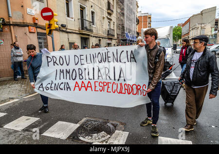 People Seen Holding A Banner Written On It Enough Of Real Estate
