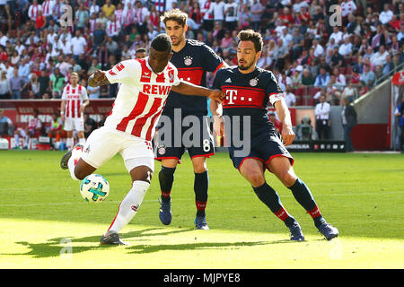 Cologne. 5th May, 2018. Jhon Cordoba (L) of FC Koeln shoots during the Bundesliga match against Bayern Munich at Rhein Energie Stadium on May 5, 2018 in Cologne, Germany. Bayern Munich won 3-1. Credit: Ulrich Hufnagel/Xinhua/Alamy Live News Stock Photo