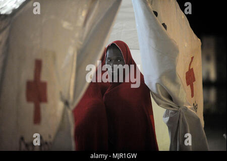 Malaga, Spain. 6th May, 2018. A migrant who was rescued from a dinghy in the Mediterranean Sea, stands inside a tent of Spanish Red Cross after his arrival at Port of Malaga. Members of the Spanish Maritime Safety rescued in this early morning a total of 110 migrants from two boats near the Malaga coast. Credit: Jesus Merida/SOPA Images/ZUMA Wire/Alamy Live News Stock Photo