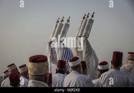 Members of the Samaritan community gather to attend an early morning Passover prayers to mark the end of the Passover holiday, atop Mount Gerizim, near the West Bank City of Nablus, 06 May 2018. The Samaritans, an ethnoreligious group of the Levant originating from the Israelites, or Hebrews, of the ancient near east, claim descent from the tribe of Ephraim and tribe of Manasseh (two sons of Joseph). According to the Torah, the Passover Sacrifice was first offered on the night of the Israelites' Exodus from Egypt. Photo: Ayman Nobani/dpa Stock Photo