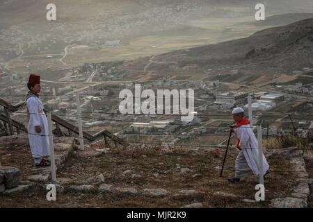 Members of the Samaritan community gather to attend an early morning Passover prayers to mark the end of the Passover holiday, atop Mount Gerizim, near the West Bank City of Nablus, 06 May 2018. The Samaritans, an ethnoreligious group of the Levant originating from the Israelites, or Hebrews, of the ancient near east, claim descent from the tribe of Ephraim and tribe of Manasseh (two sons of Joseph). According to the Torah, the Passover Sacrifice was first offered on the night of the Israelites' Exodus from Egypt. Photo: Ayman Nobani/dpa Stock Photo