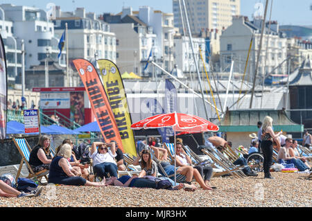 Brighton UK 6th May 2018  -  Brighton beach is packed before lunchtime as crowds flock to the south coast to enjoy the hot sunny weather Credit: Simon Dack/Alamy Live News Stock Photo