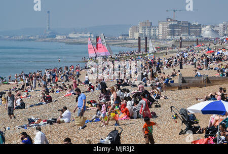 Brighton UK 6th May 2018  -  Brighton beach is packed before lunchtime as crowds flock to the south coast to enjoy the hot sunny weather Credit: Simon Dack/Alamy Live News Stock Photo