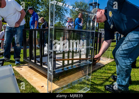 The Saltway, Droitwich, UK, 6th May 2018.  and a new sculpture by artist Katy Bienart arrives by canal barge. The sculpture represents the towns history as a salt production centre and the public where invited to fill the glass walls with salt from around the world. Credit: David Broadbent/Alamy Live News Stock Photo