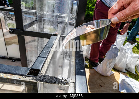 The Saltway, Droitwich, UK, 6th May 2018.  and a new sculpture by artist Katy Bienart arrives by canal barge. The sculpture represents the towns history as a salt production centre and the public where invited to fill the glass walls with salt from around the world. Credit: David Broadbent/Alamy Live News Stock Photo