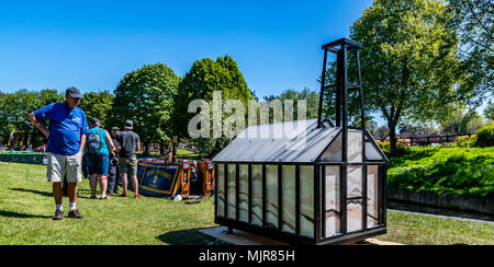 The Saltway, Droitwich, UK, 6th May 2018.  and a new sculpture by artist Katy Bienart arrives by canal barge. The sculpture represents the towns history as a salt production centre and the public where invited to fill the glass walls with salt from around the world. Credit: David Broadbent/Alamy Live News Stock Photo