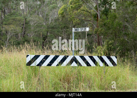 An end of road reflector barrier sign and street sign for Timber Tops Dr near Failford on the NSW mid north coast of Australia Stock Photo