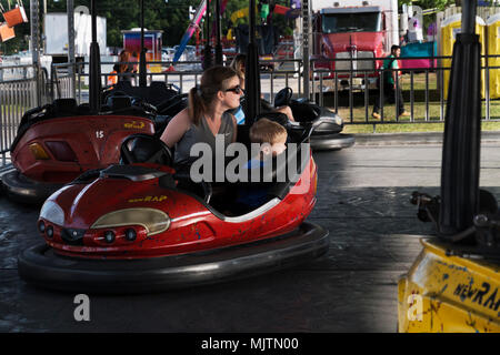 Mother and son watch for other cars in the bumper car ride at the 14th annual Hot Air Balloon Festival at Foley, Alabama. Stock Photo