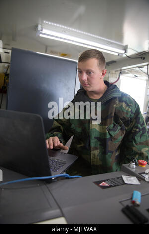 U.S. Marine Corps Expeditionary Manufacturing exercise at Marine Corps Air Ground Combat Center Twentynine Palms on Dec. 10, 2017 featured use of a Fortus 250mc 3D printer within an Expeditionary Manufacturing shelter by members of Ordnance Maintenance Company, 1st Maintenance Battalion, Combat Logistics Regiment 15, 1st Marine Logistics Group during Exercise Steel Knight 18. The archival image documents field-based additive manufacturing capability. Stock Photo