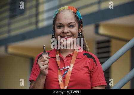 BAYAMÓN, Puerto Rico, Dec. 21, 2017--A survivor happily displays the key of her new temporary home. The FEMA Direct Lease Program provides temporary housing to survivors when rental resources are unavailable. Under this program all utilities expenses are included in the rent and covered by FEMA. Eduardo Martínez/FEMA Stock Photo