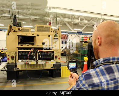 Communications-Electronics Research, Development and Engineering Center is a United States Army organization responsible for developing command, control, communications, computers, intelligence, surveillance and reconnaissance systems. In December 2018 personnel evaluated the Command Post Platform Improved demonstrator with an integrated server suite and thermal management system at Aberdeen Proving Ground. The archival image documents heat mapping and cooling assessment inside a mobile command vehicle. Stock Photo