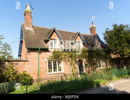 Attractive detached red brick historic house in village of Compton Bassett, Wiltshire, England, UK Stock Photo