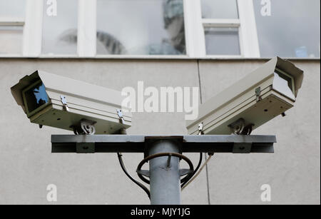 Close-up of two security cameras monted on a pole Stock Photo