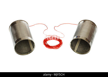 Two tin can phones connected with a cord isolated on white background. Stock Photo