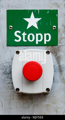 Red Swedish emergency stop button and sign. Stock Photo
