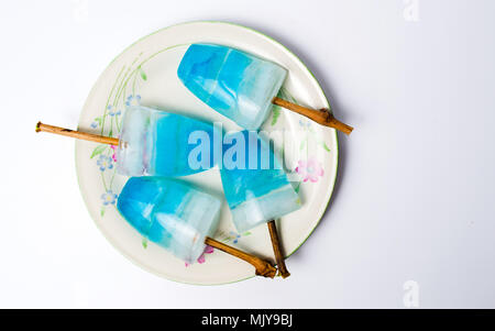 Homemade blue popsicles on table top view Stock Photo