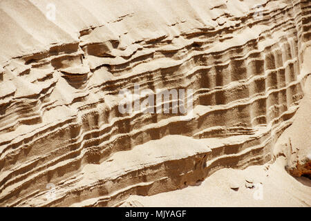 Striped patterns from the wind on a sand dune. Landscape Stock Photo