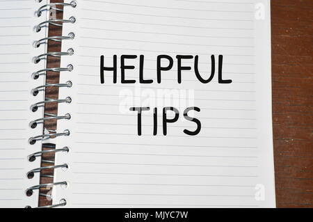 Helpful tips word written on white paper Stock Photo