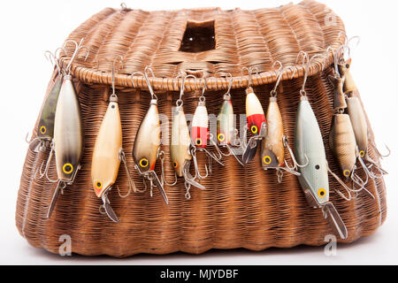 A selection of old fishing lures, or plugs, including makers such