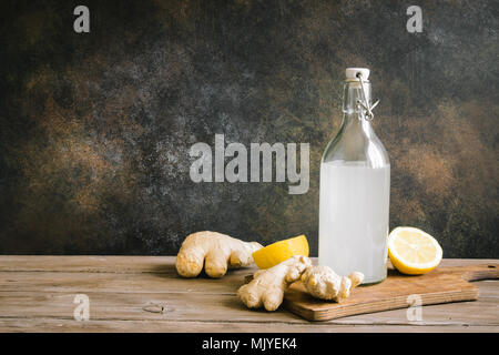 Ginger Ale in Bottle - Homemade lemon and ginger organic soda drink, copy space. Stock Photo