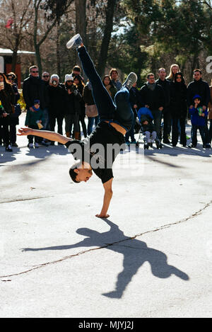 Breakdancer doing a hand stand on the streets of Madrid, Spain Stock Photo