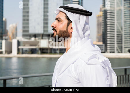 Arabic businessman wearing kandora - Portrait of traditional emirati man Stock Photo