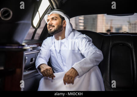 Arabic businessman wearing kandora - Portrait of traditional emirati man Stock Photo