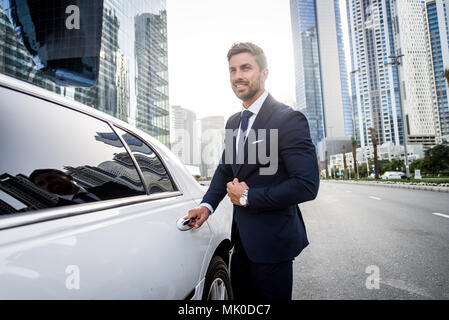Handsome caucasian businessman - Portrait of a businessman walking outdoors Stock Photo
