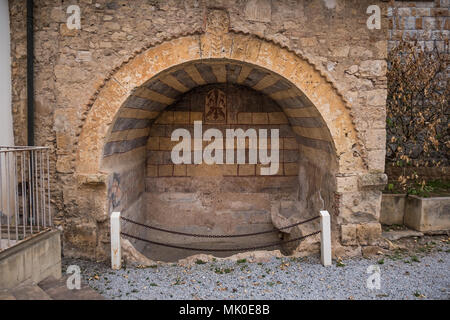 Bibbona, Leghorn, Italy - the village of Bibbona in Tuscany, medieval arch placed under the seat of the municipality Stock Photo