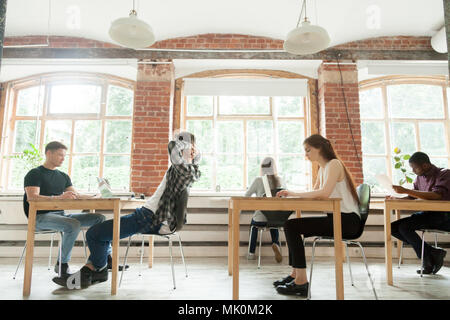 Multiethnic group working in modern coworking space Stock Photo