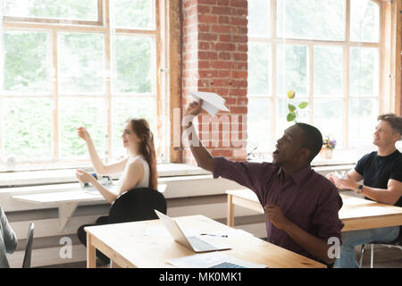 Multiethnic work team having fun in office Stock Photo