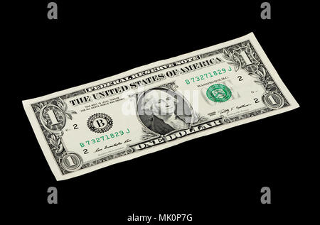 One US dollar bill isolated on black background. Stock Photo