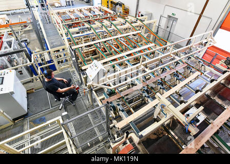 Industrial plant sawmill - production of wooden boards with modern machines Stock Photo