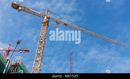 high cranes on the construction site Stock Photo