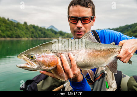 Fly Fisherman in a Belly Boat fishing for Trout in Hi Hium Lake in the  Cariboo Region of British Columbia Canada Stock Photo - Alamy, belly boat