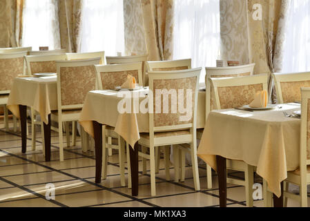 interior of restaurant in yellow tones Stock Photo