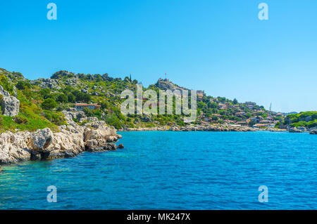 Kalekoy village is important part of tourist routes around Kekova bay, here located ruins of the ancient Simena settlement and Byzantine castle on the Stock Photo