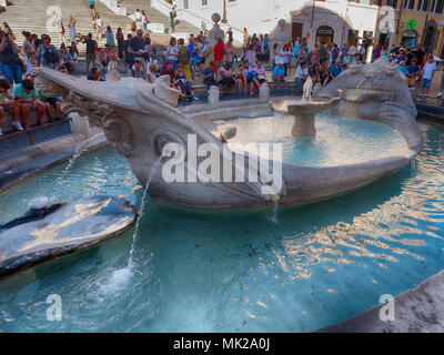 Rome, Italy - July 2017: Fountain of the Ugly Boat at the Spanish Steps Stock Photo