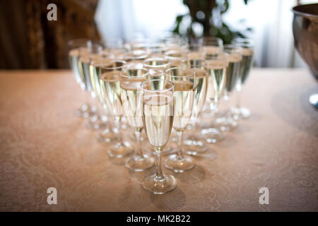 Glasses with champagne on the table Stock Photo