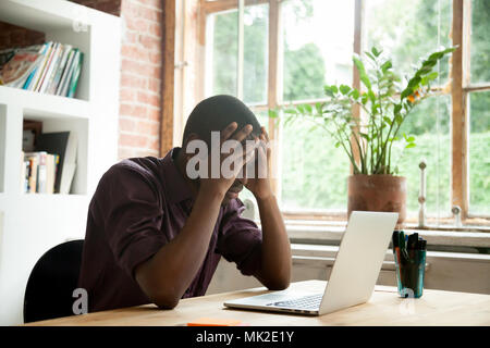 Frustrated black worker disappointed with company crisis Stock Photo