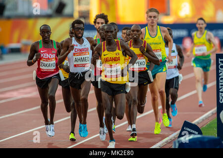 GOLD COAST, AUSTRALIA - APRIL 8: Joshua Kiprui Cheptegei of Uganda and Mohammed Ahmed of Canada competing in the Men's 5000m final at the Gold Coast 2 Stock Photo