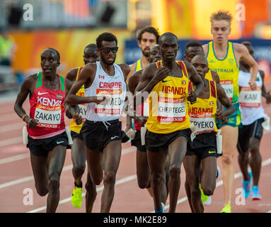 GOLD COAST, AUSTRALIA - APRIL 8: Joshua Kiprui Cheptegei of Uganda and Mohammed Ahmed of Canada competing in the Men's 5000m final at the Gold Coast 2 Stock Photo