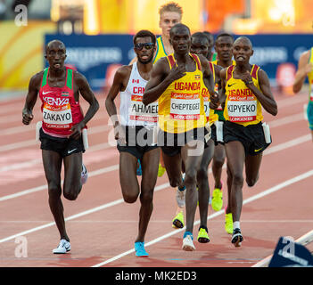 GOLD COAST, AUSTRALIA - APRIL 8: Mohammed Ahmed of Canada and Joshua Kiprui Cheptegei of Uganda competing in the Men's 5000m final at the Gold Coast 2 Stock Photo